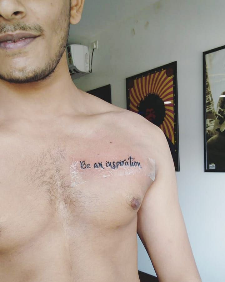 Written Chest Tattoos:  Simple Words, Big Impact!